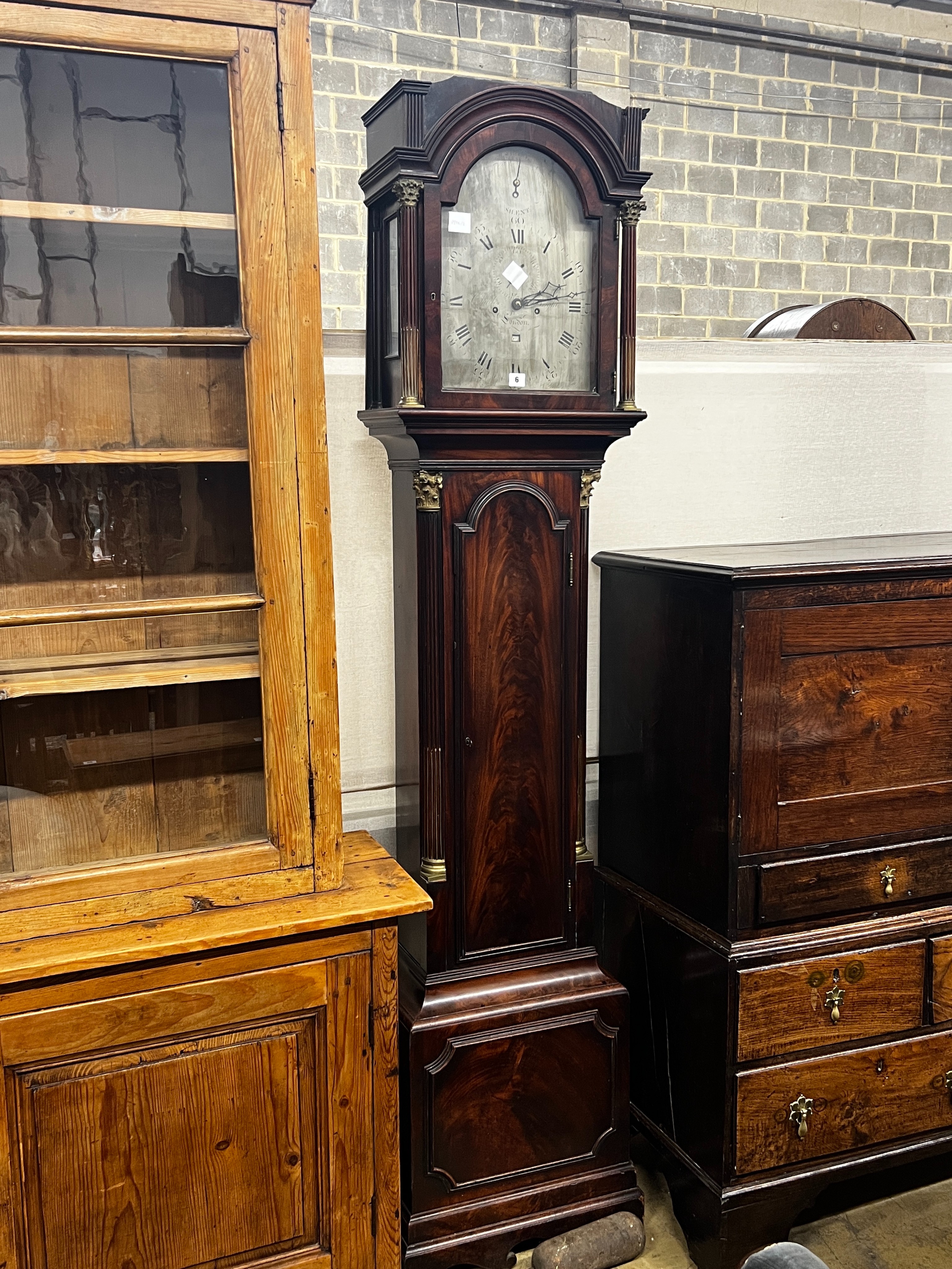 A George III mahogany 8 day longcase clock, the 12in arched silvered dial, marked Charles Bright, London, height 219cm